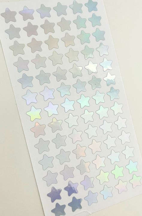 1/2 Inch (13 mm) Mini Star Sticker Sheet **Color shown in listing photo is HOLO SILVER **78 stars per sheet** These mini stickers are made of permanent grade adhesive vinyl and are water and weather resistant. These stickers can be used on various smooth surfaces such as paper, metal, glass, laptops, iPads, cell phones, tumblers, etc. Vinyl stickers are easily removed, but are not reusable. Seller is not responsible for stickers during application. Star Sticker Sheet, Holo Stickers, Tiny Stickers, Mini Stickers, Tiny Star, Cute Stars, Wedding Scrapbook, Star Stickers, Blue Star