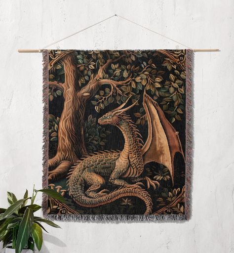 Unveil the magic of our Medieval Magic Dragon Throw Blanket 🐉✨ Perfect as a housewarming or outdoor gift for her, or any Dungeons & Dragons (D&D) lover. This 100% cotton woven tapestry brings fantasy to life with its intricate botanical, cottagecore, and goblincore-inspired design. Cozy up on the sofa, bed, or take it outdoors for a picnic. Ideal for folklore decor and enchanted magic enthusiasts, this blanket ensures warmth and comfort by the fireplace or under the stars. Folklore Decor, Botanical Cottagecore, Weave Artwork, Medieval Magic, Room Nature, Anniversary Blanket, Couples Blanket, Magic Dragon, Medieval Dragon