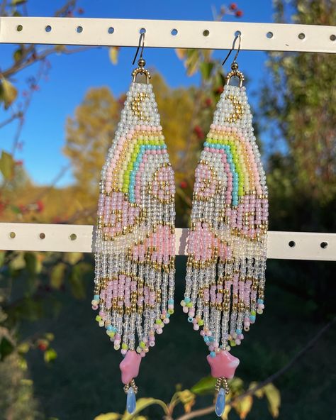 Rainbow & Pink Clouds Earrings💕☁️🌈 Made with size 11/0 seed beads, fireline and one g thread, stainless steel. Length is 5” (Bead pattern by @rissa.bead . I have permission) These will be available in @rissa.bead ‘s kofi shop later✨ . . . . . . . . . . . . . . . #rainbow #cloudearrings #seedbeadearrings #earrings #pink #pastel #gold #earringshop #handmadeearrings #handmadejewelry #seedbeads #beading #native #cutejewelry Pink Clouds, Seed Bead Earrings, Seed Bead Jewelry, Handmade Earrings, Shop Earrings, Cute Jewelry, Beading Patterns, Seed Beads, Jewelry Accessories