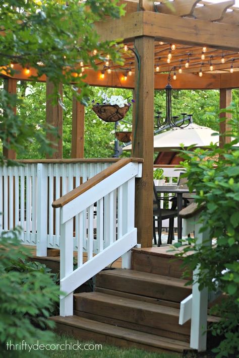 Gorgeous deck with pergola, lights and white railings...love!  Thrifty Decor Chick blog Pergola Lights, White Pergola, Cheap Pergola, Patio Pergola, Thrifty Decor Chick, Building A Pergola, Pergola Lighting, Pergola Attached To House, Wood Pergola