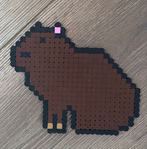 this capybara is made of beads Capybara Perler Beads, Cappy Barra, Capybara Craft, Hama Animals, Capybara Aesthetic, Square Drawing, Pixel Art Grid, Hama Beads Patterns, Diy Perler Beads