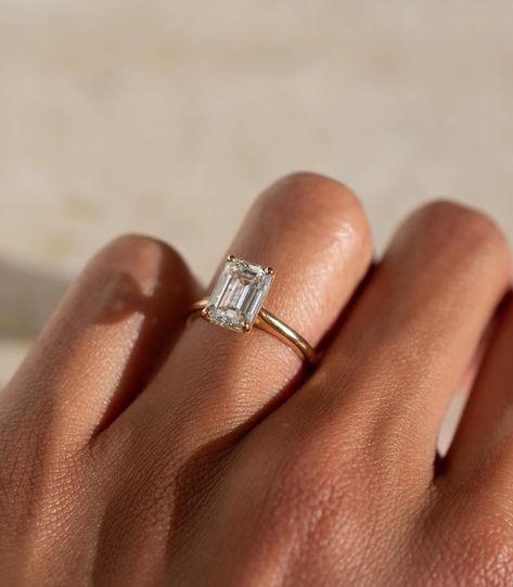 A timeless emerald cut solitaire design, with a lifted cathedral setting ✨ Details: - 2.05ct emerald cut diamond - 18k yellow gold - 1.8mm wide shank #engagementringdesign #customengagementring #emeraldengagementring #nz #aus Emerald Cut Solitaire, Cathedral Setting, Emerald Cut Diamond, Emerald Engagement Ring, Emerald Cut Diamonds, Custom Engagement Ring, Designer Engagement Rings, Emerald Ring, Emerald Cut