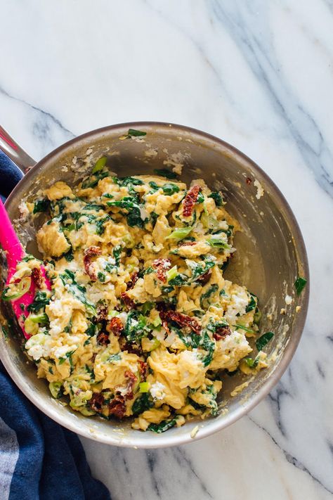 Incredibly creamy scrambled eggs, made with goat cheese, spinach and sun-dried tomatoes. #scrambledeggs Breakfast Bowl Egg, Creamy Scrambled Eggs, Scrambled Eggs Recipe, Mexican Breakfast Recipes, Cheese Spinach, Eat Happy, Spinach And Cheese, Sun Dried Tomatoes, Vegetarian Breakfast