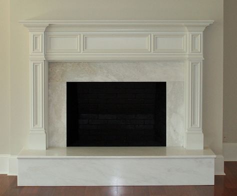 I like the structure of this... obviously there wont be a raised hearth or marble within the framing, but the style is nice. Fireplace Classic, Fireplace Lounge, Fireplace Hearths, Raised Hearth, Fireplace Walls, Mantel Shelves, Wood Fireplace Surrounds, Small Basement Remodeling, Fireplace Redo