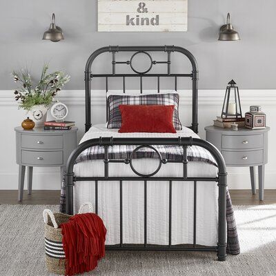 This standard bed has details that make a statement in your bedroom. It's made from metal and includes a series of slats that provide a sturdy base for a box spring and mattress of your choice. Plus, we love how the open design headboard and footboard with their spindle details, rounded corners, and joinery accents create a farmhouse-inspired look, providing the perfect backdrop for your favorite sheets and duvets. The black finish means you can easily mix this into your current color palette. S Black Iron Beds, Wrought Iron Beds, Wrought Iron Bed, Boy’s Room, Curved Headboard, Standard Bed, Iron Bed, Boy's Bedroom, Adjustable Beds