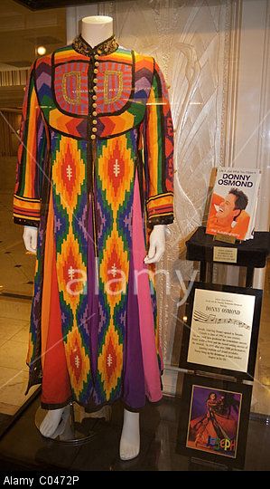 The title garment worn by Donny Osmond in Andrew Lloyd Webber's "Joseph and the Amazing Technicolor Dreamcoat." Stock Photo Joseph's Technicolour Dreamcoat, Joseph Technicolor Dreamcoat, Joseph And The Technicolor Dreamcoat, Joseph And The Amazing Technicolor Coat Costumes, Joseph And The Amazing Technicolor Coat, Joseph Costume, Joseph Coat, Dance Worship, Technicolor Dreamcoat