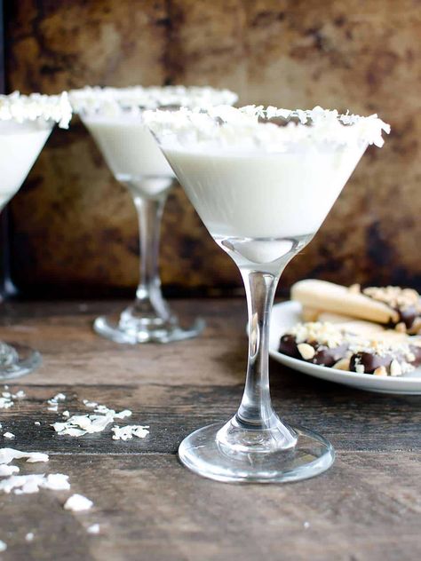 Nonalcoholic pineapple coconut martini's with a plate of chocolate dipped lady fingers. Coconut Mocktail, Coconut Martini, Holiday Drinks Alcohol Christmas, Christmas Drinks Nonalcoholic, Festive Holiday Drinks, Holiday Drinks Alcohol, Christmas Drinks Alcohol Recipes, Coconut Creme, Christmas Drinks Alcohol