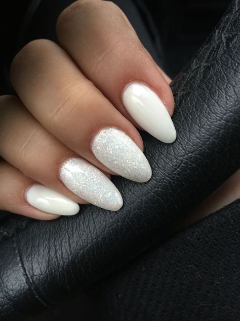 Frosted White Nail Designs, White And Silver Nails Acrylic Almond, White Nails With Glitter Almond Shape, White Bridal Nails Sparkle, Winter White And Silver Nails, White Oval Nails With Glitter, Nails Acrylic White Sparkle, Prom Nails White And Silver Almond, White Almond Glitter Nails