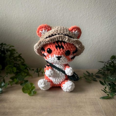 Tiger Safari PDF, Amigurumi Crochet Safari Cute Patterns, Stuffed Animals, Children's Gifts Digital PDF Create your own tiger. PLEASE NOTE: This is a digital PDF pattern, not a finished toy as shown in the photos! PATTERN LANGUAGE: English SKILL LEVEL: Beginner - Intermediate Materials: Cotton yarn (I use YarnArt Jeans 50g/160m/174yds) Yarn colors: White Orange Brown Crochet hook size: 2.1 mm Safety eyes size: 8 mm Black embroidery thread for eyebrows and eyes This crochet pattern does not inclu Tiger Crochet, Crochet Tiger, Pattern Language, Yarnart Jeans, Brown Crochet, Lovey Pattern, Cute Patterns, Basic Crochet, Photo Pattern