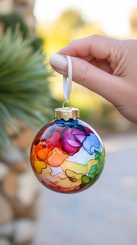 20 Creative Christmas Crafts Adults Will Love To Make Clear Xmas Ornament Ideas, Diy Christmas Glitter Ornaments, Plastic Fillable Ornament Ideas, Diy Glass Ball Ornaments, Clear Ornaments Diy Christmas, Modge Podge Ornaments, Clear Christmas Ball Ornament Ideas Diy, Diy Clear Ornament Ideas, Christmas Bauble Ideas