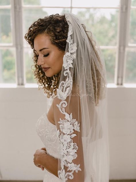 The flower lace on this fingertip wedding veil is embellished with opaque glass beads and clear sequins to create just the right amount of sparkle! This elegant veil is available in cathedral (ivory only) and fingertip length, 108 x 72 or 41 x 72 on a metal comb. Bride Hairstyles With Veil, Fingertip Length Wedding Veil, Lace Trimmed Veil, Cathedral Length Wedding Veil, Elegant Veils, Fingertip Wedding Veils, Cathedral Wedding Veil, Winter Wedding Hair, Fingertip Veil