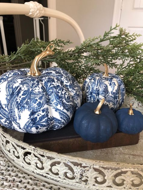 This totally unique set of navy and white chinoiserie style pumpkins is one of my best seller's and sure to add some rich elegance to your fall arrangement or centerpiece.  They are timeless classics.  The sizes are... 7 by 5 4 by 3 3 by 2 The two largest are  decoupaged with a  rich navy blue and white damask print. The one baby pumpkin is  hand-painted in a mixture of chalk paint and are a deep navy.  All of them have goldleaf painted stems.  They are gorgeous when added to a bookshelf, a sofa Blue Fall Decor, Chinoiserie Pumpkins, Fall Pumpkin Centerpieces, Chinoiserie Blue, Blue And White Chinoiserie, Blue White Decor, Fall Arrangements, Fall Thanksgiving Decor, Blue Pumpkins