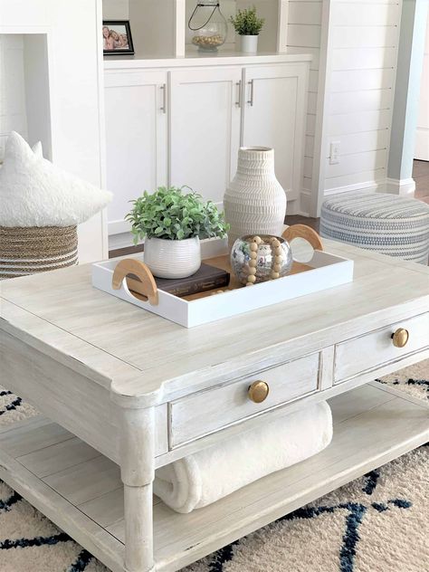 Need some help finding the perfect coastal style coffee table? Try 10 Best White Coastal Chic Coffee Tables by thetarnishedjewelblog.com. Over 50+ styles!! #coastalcoffeetable #whitecoffeetable #whitewash #whitewashed #whitewashfurniture #coastalliving #coastallivingroom #coastallivingstyle #coastalchic #coastalchicdecor #coastalchicdecor #coastalfarmhouse #coastalfarmhousestyle #coastalfarmhousedecor #coastaldecor #coastalhomedecor Coffee Table Arrangment, Farmhouse Coffee Table Decor, Coffee Table Vignettes, Coffee Table Decor Living Room, Chic Coffee Table, Table Decorating, Table Decor Living Room, Simple Coffee Table, Coffee Table Farmhouse