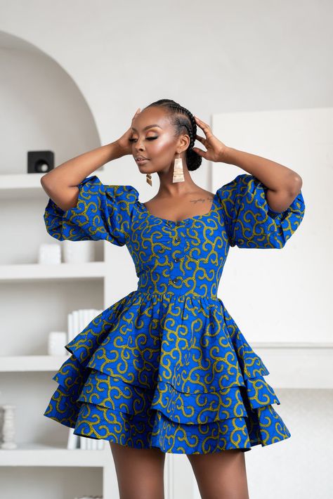 Short Dresses African Style, Cute Traditional Dresses, Ladies Short Dresses Style, Long Sleeve Traditional Dress, Long Sleeve African Print Dress, African Dress For Teens, African Pagne Dress, Cute Kitenge Dress Designs, Puffy Sleeve Short Dress