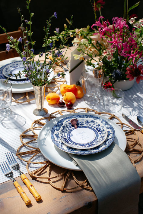 Blue and white vintage china plates are the star of this place setting accented with a wicker flower charger and bamboo flatware. The sage green napkin and white plate bring a modern element to this high detail place setting. Spanish Elopement, Anastasia Wedding, House Community, Bamboo Flatware, Glass Charger Plates, Photography Trends, Custom Wedding Stationery, Wedding Place Settings, White Plate