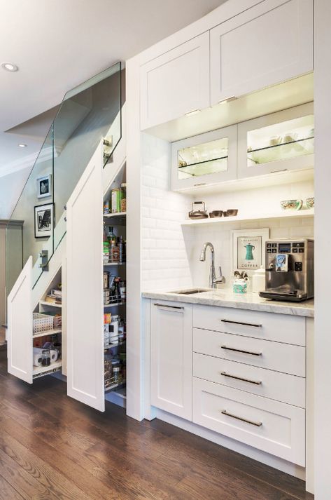 We share 11 genius ideas for awkward under-stair space. Under-stair space is often neglected or not used to its full potential so let our list help inspire your creativity. Including this smart and practical idea for an organised pantry. Using pull-out shelving makes clever use of this tricky space. Click the image for this and more great tips. Cabinet Under Stairs, Bar Under Stairs, Kitchen Under Stairs, Under Stairs Pantry, Food Storage Cabinet, Stairs In Kitchen, Model Dapur, Stairs Storage, Staircase Storage