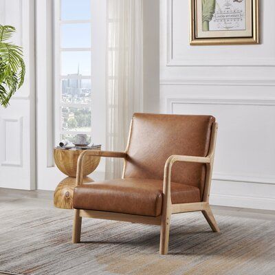 Add a unique seating solution to any space with the vintage-inspired charm. Constructed from manufactured wood in a warm finish, this beautifully upholstered armchair features a padded seat and back to keep you comfortable whether you're reading, watching tv, or just hanging out. You surely love the stylish touch this piece brings to your decor. | Corrigan Studio® Cameron Faux Leather / Wood in Brown, Size 31.0 H x 26.0 W x 25.98 D in | Wayfair Leather Side Chair Accent Chairs & Armchairs, Leather Accent Chair Bedroom, Leather Accent Chairs For Living Room, Tan Leather Accent Chair, Tan Accent Chair, Brown Leather Accent Chair, Leather Accent Chairs, Brown Leather Chair, Living Room Accent Chairs