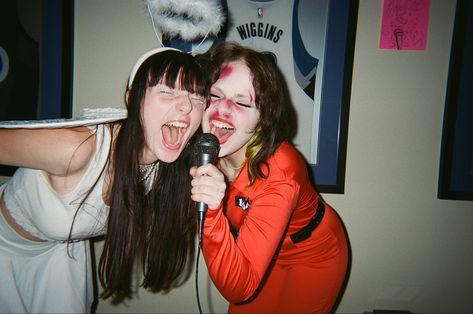 halloween party angel singing screaming into microphone film fujifilm disposable friends aesthetic Scream Singing Aesthetic, People Singing Reference, Art Reference Photos Friends, Two People Singing Reference, Singing With Microphone Pose, Singing Into Microphone Reference, Singing Aesthetic Microphone, Screaming Into Microphone, Singing With Friends Aesthetic