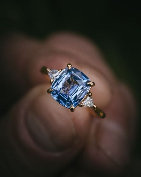 Moira Patience Fine Jewellery on Instagram: "I adore these pale blue Ceylon sapphires - they're so bright and cheerful. This particular gemstone stole my heart on a buying trip last year and I was delighted to set it in this bespoke engagement ring; it looks perfect framed with trillion cut diamonds in yellow gold. My client was originally in the showroom looking at diamonds, but he spotted this sapphire twinkling in the cabinet and and that was that...! 💙✨ . . . . . . #moirapatience #sapphire #diamonds #engagementring #bespokeengagementring #bridaljewellery #wedding #jewelryaddict #gemstones #luxuryjewellery #jewellerylovers" Sapphire Diamond Engagement Ring, Original Engagement Rings, Diamond Sapphire Engagement Ring, Sapphire Diamond Engagement, Ring Inspiration, Ceylon Blue Sapphire, Engagement Ring Inspiration, Bespoke Engagement Ring, Ceylon Sapphire