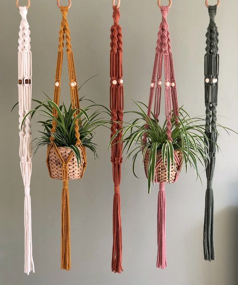 Boho Macrame Plant Hanger handmade from 100% recycled natural cotton and available in two sizes and a choice of five colours. Featuring intricate spiral knot details and lovely wooden beads.   SUSTAINABLE, NATURAL, AND HANDMADE WITH LOVE  All my macrame pieces are 100% plastic-free and made using natural, sustainable premium quality materials. Each plant hanger is carefully handmade to order in my studio in Ashbourne, Derbyshire. For every order made - I also plant a tree!  COLOURS: Available in Beaded Plant Hanger, Spiral Knot, Wall Mounted Planters, Macrame Plant Hanger Patterns, Hanging Terrarium, Hanging Plant Wall, Macrame Hanger, Hanger Design, Macrame Patterns Tutorials