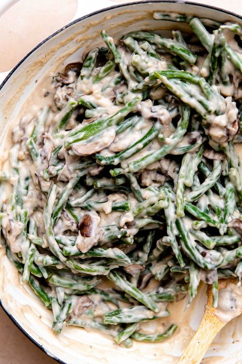 This Make Ahead Green Bean Casserole recipe is a homemade version of the classic side dish that you can prep up to 2 days in advance! Stir fresh green beans into a béchamel-style creamy mushroom sauce & top with French fried onions & slivered almonds. So easy, & no mushroom soup cans! A made from scratch holiday staple, perfect for Thanksgiving, Friendsgiving, or any other special occasion meal! #greenbeancasserole #makeaheadgreenbeancasserole #thanksgivingrecipes #thanksgivingsidedishes Make Ahead Green Bean Casserole, Green Bean Casserole From Scratch, Crowd Pleasers Recipes, Fresh Green Bean Casserole, Green Bean Casserole Recipe, Classic Green Bean Casserole, Greenbean Casserole Recipe, Thanksgiving Friendsgiving, Cooking Green Beans