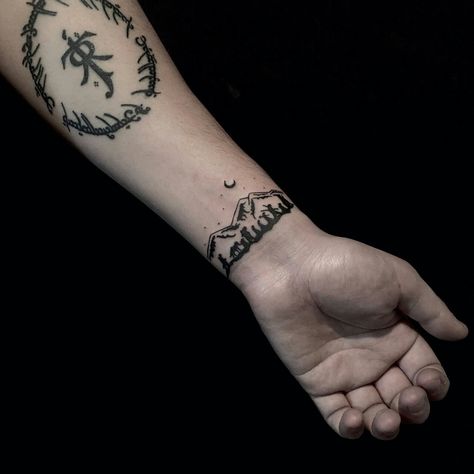 Lotr tattoo. Amazing but why would you do that? Snowdonia Tattoo, Ring Of Barahir Tattoo, Lotr Wrist Tattoo, Lotr Sleeve Tattoos For Guys, Lotr Fellowship Tattoo, Lotr Forearm Tattoo, Lotr Tattoo Minimalist, Small Lotr Tattoos, Middle Earth Tattoo