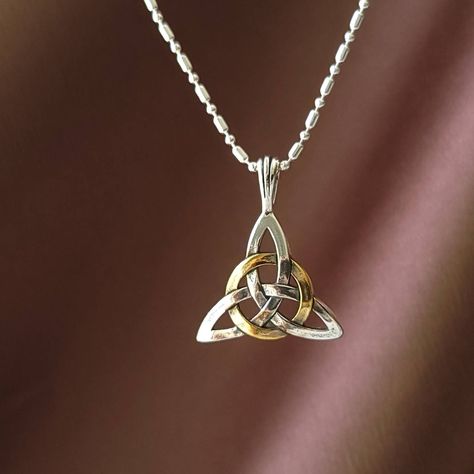 "Celtic Triangle Knot in solid 925 sterling silver with 24 gold plate. Has the phrase, \"Circle of Life\" inscribed on the flip-side of the pendant.  Celtic Knot in a triangular formation is also called the Trinity Knot, and Triquetra.  The points on the triangle symbolize the three natural elements, earth, air, and water. The connected swirls symbolize the eternal circle of life.  In the Christian religion, the Triquetra  symbolizes the Holy Trinity.  This symbol is often used in engagement and Triquetra Art, Triquetra Jewelry, Celtic Triangle, Lovers Knot, Celtic Knot Jewelry, Elements Earth, Trinity Knot, Irish Jewelry, Symbolic Jewelry