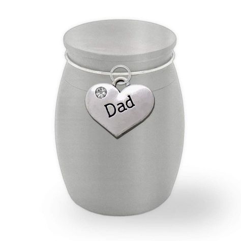 PRICES MAY VARY. Small heavy stainless steel urn to hold a small amount of precious cremains Mini size - Approximately 1 1/2 tall x 1 inch wide (not a full size urn - holds a small amount of cremains) Stainless steel with Dad heart charm and secure screw on top Divide Cremains and give one to each person to have a small keepsake to display at home This small stainless steel urn with a matte finish cremation container with screw on top will hold a small amount of cremains. Give a sharing urn to e Father Memorial, Personalized Name Plates, Trash Containers, Waste Container, Small Urns, Keepsake Urns, Memorial Urns, Cremation Urns, Jar Containers