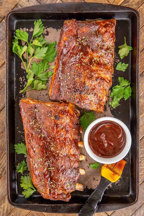 Slow Cooker Baby Back Ribs - a foolproof recipe for baby back ribs. These are THE BEST ribs I've ever eaten! PLUS they are super easy to make! Simply coat baby back ribs in a homemade BBQ rub and slow cook in the crockpot. Finish them with some BBQ sauce under the broiler. Baby back ribs, brown sugar, smoked paprika, kosher salt, black pepper, cayenne pepper, onion powder, garlic powder, and BBQ sauce. These are better than any restaurant! #slowcooker #crockpot #ribs #bbq Homemade Bbq Rub, Slow Cooker Baby Back Ribs, Babyback Ribs Recipe, Slow Cooker Ribs Recipe, Bbq Pork Recipes, Ribs Bbq, Crockpot Ribs, Slow Cooker Ribs, Plain Chicken