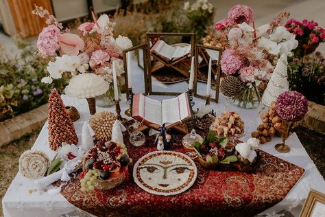 Sofreh Aghd table with traditional offerings and scripture of the couples choosing surrounded by colourful flowers Iranian Wedding Table, Sofreh Aghd Modern, Sugared Almonds Wedding Favours, Iran Wedding, Anguilla Wedding, Pink And White Wedding Flowers, Almond Wedding Favours, Persian Weddings Sofreh Aghd, Back Garden Wedding