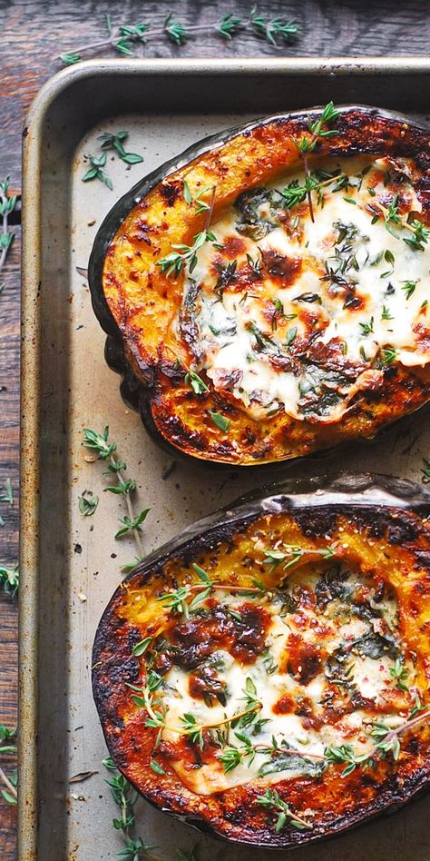 Stuffed Acorn Squash with Creamy Spinach and Cheese on a baking sheet Italian Acorn Squash Recipes, Fall Meal Vegetarian, Baked Stuffed Squash, Salad With Acorn Squash, Delish Keto Recipes, Main Dish Ideas For A Party, Sliced Butternut Squash Recipes, Autumn Gluten Free Recipes, Vegtables Dishes Winter