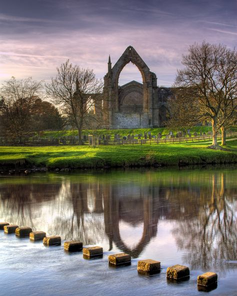 The beautiful Bolton Abbey priory and stepping stones. #cavendishpavilion #boltonabbey #yorkshire #northyorkshire #yorkshiredales #beauty #river #steppingstones #travel #pictureperfect #scenery #views #mirroring #greenery #scenic #symmetry #landscape Photo credit: Chris Northall Bolton Abbey, Travel International, Uk Trip, Invisible Cities, Scenic Photography, Family Days Out, Yorkshire Dales, Yorkshire England, English Countryside