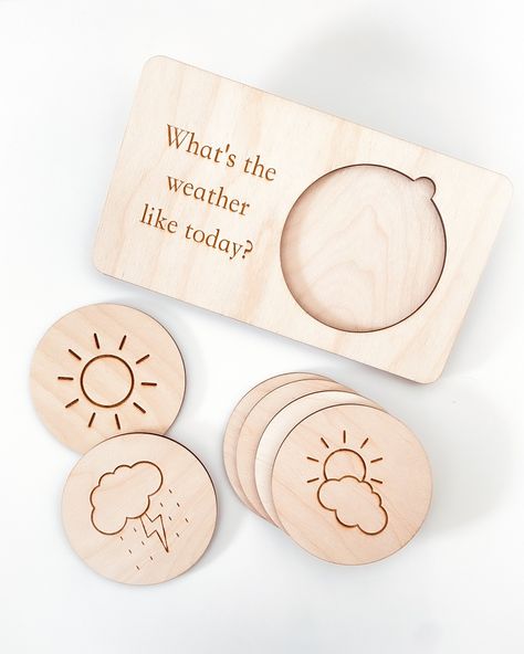 "Our wooden weather board is perfect to accompany the youngest members of the family in their intellectual development in a fun and entertaining way.  This daily morning board includes the board (with a support on the back) + 6 pieces with different weather designs: sun, sun and clouds, clouds, rain, storm, snow.  ** PRODUCT SIZE: 8.2 \"x4.72\" (20x18cm) Available in english, spanish and catalan. For other languages, please, contact us before or write in the personalization box the text you want. We have a wide range of products to choose from, including this beautiful growth chart for kids and baby: https://www.etsy.com/listing/1383539630/personalized-growth-chart-with-stars?click_key=0a81e09669650db00e8c152eb844fed382b6fb8f%3A1383539630&click_sum=c4b6da90&ref=shop_home_active_24&pro=1&fr Back To School For Kids, Diy Montessori Toys, Wood Laser Ideas, Morning Board, Personalized Growth Chart, Laser Cut Wood Crafts, Laser Engraved Ideas, Board For Kids, Toddler Gift