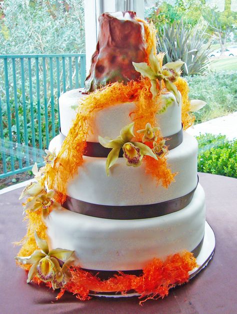 Volcano wedding cake Volcano Centerpiece, Volcano Wedding, Volcano Birthday Cake, Volcano Birthday Cakes For Boys, Dinosaur Volcano Birthday Cake, Volcano Cake, Hawaii Themed Party, Luau Wedding, Hawaii Theme