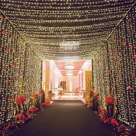 Wedding Gate Decoration, Fairy Lights Wedding Decorations, Indian Wedding Decorations Receptions, Wedding Gate, Reception Stage Decor, Fairy Lights Wedding, Gate Decoration, Wedding Background Decoration, Wedding Entrance Decor