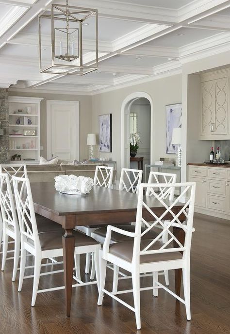 Morgan Harrison Home - A nickel cage lantern hangs from a white coffered ceiling over a dark brown wood French dining table surrounded by white bamboo lattice chairs accented with taupe leather seat cushions. White Coffered Ceiling, Painted Dining Room Table, Dark Wood Dining Table, French Dining Tables, Dark Table, Dark Wood Table, White Chairs, Black Dining Chairs, White Dining Table