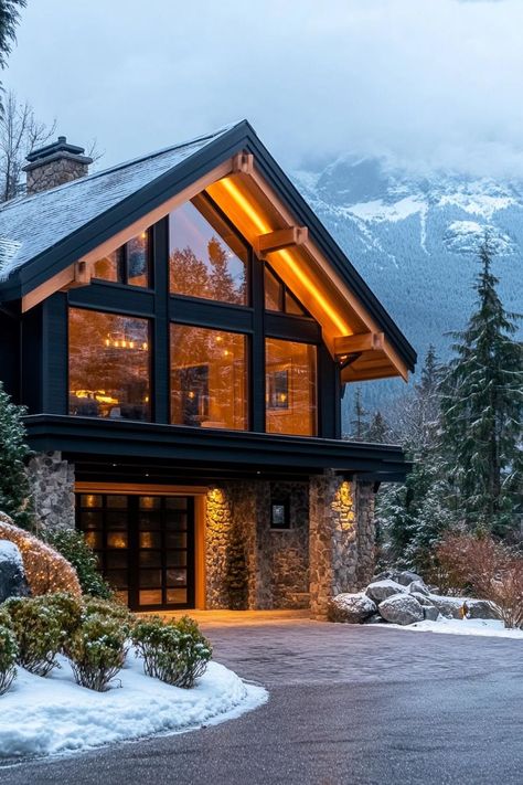 Charming stone chalet with warm lights amidst snowy scenery. Embark on a whirlwind tour of luxurious abodes where opulence meets whimsy, leaving you green with envy and ideas for your next home upgrade. Houses With Floor To Ceiling Windows, Swiss Chalet House Exterior, Luxury Cabin Homes, Mountain Modern Home Interiors, Snowy Scenery, Mountain Dream Homes, Mountain Modern Home, Forest Home, Building A Cabin