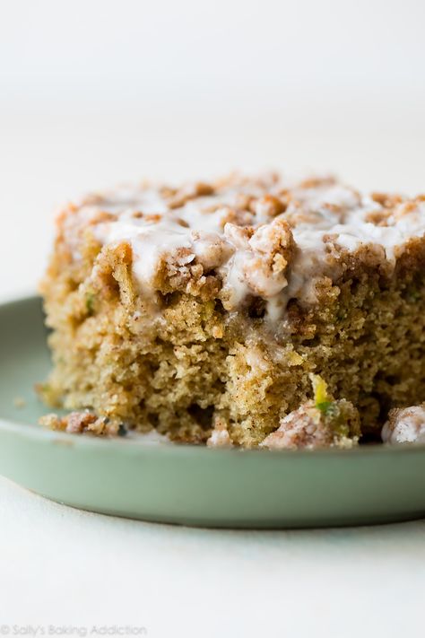 Zucchini crumb cake is moist, spiced with cinnamon, topped with brown sugar crumble, and sweet vanilla icing! You can't even tell you're eating your veggies! Delicious coffee cake recipe on sallysbakingaddiction.com Zucchini Snack Cake, Zucchini Coffee Cake, Crumb Cake Muffins, Zucchini Recipes Dessert, Sallys Baking, Crumb Cake Recipe, Sally's Baking, Vanilla Icing, Zucchini Muffins