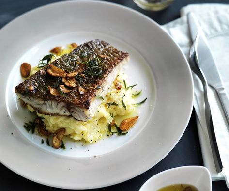 The creamy potato dip with roasted garlic complements the crispy-skinned firm white fleshed fish perfectly. Serve with veg for a satisfying meal. Skordalia Recipe, Barramundi Recipes, How To Make Crisps, Friday Recipes, Potato Dip, White Bean Puree, Asian Marinade, Fish Dinners, Roasted Cod