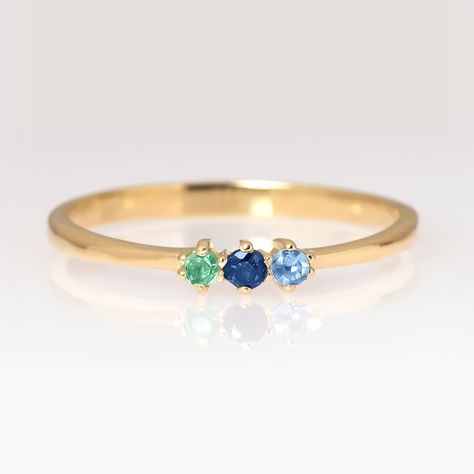 A minimalist birthstone ring that you can wear alone or stack it with other rings. This solid gold ring is a must have in your collection. Perfect gift idea for your loved ones. ✨ 𝓡𝓲𝓷𝓰 𝓭𝓮𝓽𝓪𝓲𝓵𝓼:  𝗠𝗮𝘁𝗲𝗿𝗶𝗮𝗹 : solid gold 14k with the official European stamp "585" (The material is NOT gold filled or gold plated.) 𝐖𝐞𝐢𝐠𝐡𝐭: 1.2 gr approximately  𝐖𝐢𝐝𝐭𝐡:  1.9 mm on the bottom 𝐇𝐞𝐢𝐠𝐡𝐭: 2.8 mm on the top 𝐃𝐢𝐦𝐞𝐧𝐬𝐢𝐨𝐧𝐬: 3 stones 0.02 ct-1.7 mm each ► Available Births 3 Stone Birthstone Ring, 3 Stone Mothers Ring Ideas, Birthstones Ring, Xmas 2024, Mothers Ring, June Birthstone Ring, Birthstone Rings, Mother Rings, Personalized Ring