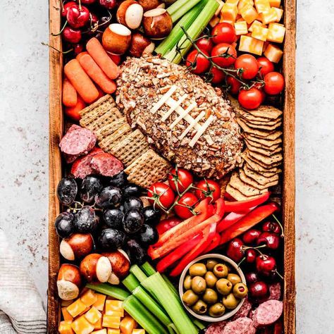 Celebrate football season in style with this stunning football charcuterie board! It's easy to assemble and perfect for game day! Football Charcuterie Board, Football Charcuterie, Holiday Party Food Appetizers, Football Party Food Ideas, Snack Board Ideas, Appetizers And Dips, Healthy Tailgate, Healthy Tailgate Food, Football Themed Food