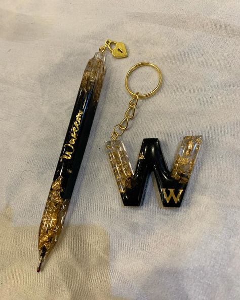 A Black Gold Resin Keychain Pen Set is a stylish and practical accessory. It includes a keychain and a pen, both made with a beautiful black and gold resin design. It’s perfect for keeping your keys organized and having a pen handy whenever you need it. It’s a great gift idea too! 😊🖊️. 🔑. #art #resin #pen #artist #artistsoninstagram #resinartwork #resincraft #craft #foryoupage #followforfollowback #support #womenartists Resin Pen Ideas, Resin Keychain Ideas, Keychain Pen, Black And Gold Resin, Resin Pens, Resin Pen, How To Make Resin, Resin Artist, Times Quotes