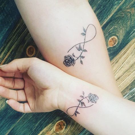 Infinity With Rose Tattoo On Wrist Rose Tattoo On Wrist, Mother Daughter Infinity Tattoos, Infinity Tattoo On Wrist, Grey Ink Tattoos, Cute Matching Tattoos, Tattoo On Wrist, Infinity Tattoo Designs, Tattoos Infinity, Small Rose Tattoo