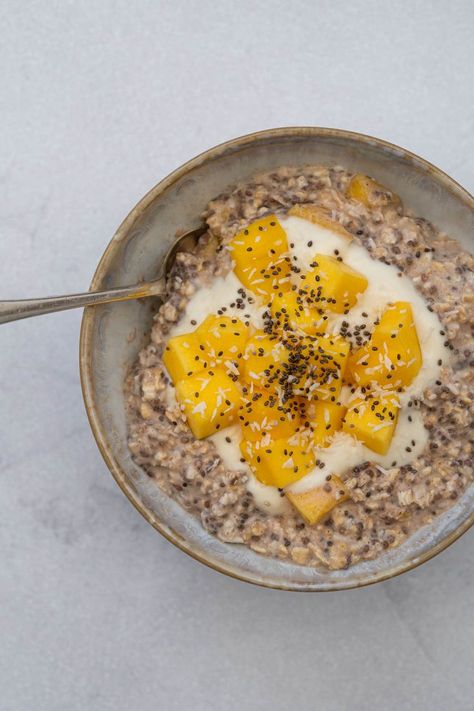 Mango chia seed and coconut overnight oats topped with greek yogurt, fresh mango and a sprinkling of desiccated coconut in a rustic bowl on a white marble background Coconut Overnight Oats, Coconut Oats, Plantbased Recipes, Coconut Yogurt, Overnight Oats, Chia Seeds, Easy Breakfast, Gluten Free Vegetarian, Coconut Milk