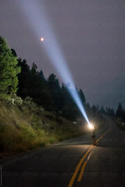 A young woman standing on a highway shining a flashlight toward the sky by Christian Tisdale for Stocksy United Flashlight Aesthetic, Polaroids Ideas, Flashlight Photography, Twin Peaks Theme, Does He Like You, Art Alevel, Photography Club, Online Quiz, Stranger Things Aesthetic