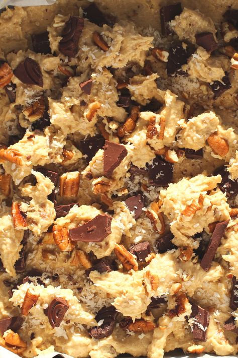 These Keto Cowboy Cookie Bars is an adaptation of a 5/5 star NY Times recipe. These easy low-carb cowboy cookies which have been made into bars taste as they came from a fancy bakery! They are thick and chewy and full of nutty goodness!   Simply combining coconut, pecans, cinnamon and chocolate, these cookie bars make the most flavourful gluten-free and sugar-free keto cookie bars! Low Carb Cowboy Cookies, Keto Bar Cookies, Keto Cowboy Cookies Recipe, Keto Cowboy Cookies, Cowboy Cookie Bars, Cowboy Bars, Keto Cookie Bars, Fancy Bakery, Cowboy Cookie