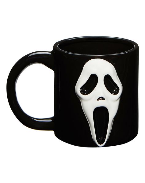 Take a sip of your favorite horror movie monster with this officially licensed Ghost Face® coffee mug! It's the perfect addition to your horror collection and you'll never have to drink your morning coffee alone again. Officially licensed Capacity: 16 oz. Material: Dolomite Care: Hand wash Imported Ghost Face is a registered trademark of Fun World Div., Easter Unlimited Inc. Ghost Face protected under worldwide copyright registration and is the exclusive property of Fun World Div., Easter Unlimi Horror Movie Night, Scream Mask, Horror Collection, Black And White Face, Spencers Gifts, Face Mug, Fun World, Ghost Face, Halloween Decorations Indoor