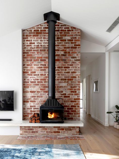 7 Cozy Fireplaces to Keep You Warm All Winter - Cottage Journal Brick Fireplace With Wood Stove, Wood Burning Stoves Living Room, Design Camino, Wood Stove Fireplace, Big Room, Wood Heater, Edwardian House, Freestanding Fireplace, Street House