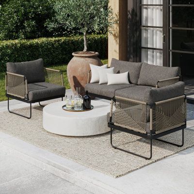 Transform your patio with the outdoor sofa set, a stylish 3-piece patio conversation set for your outdoor oasis. This outdoor loveseat and chair set with metal frame is designed to withstand the elements with its sturdy black metal body and rust-proof hardware, ensuring long-lasting durability. No more boring outdoor furniture because we added a unique woven rope design to make it extra durable and stable while giving it a touch of boho chic flair. The Isla sofa set has a spacious seat size and Bookshelves Living Room, Dresser With Tv, Nathan James, Bohemian Outdoor, Mid Century Modern Minimalist, Patio Loveseat, Sofa Seating, Outdoor Loveseat, Outdoor Sofa Sets