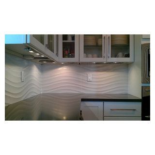 Custom Surface Solutions - Owner Craig Thompson (512) 430-1215. This album shows a kitchen backsplash with UBkitchen cabinets, large 35" x 12.5" white wave Wavy Kitchen Backsplash, Wavy Tile Backsplash Kitchen, Kitchen Backsplash Outlets, Backsplash Outlets, Wavy Tile, Large White Tiles, Outlet Placement, Craig Thompson, White Tile Kitchen Backsplash